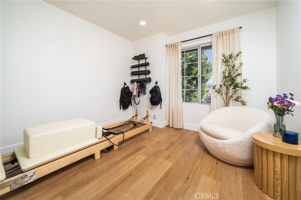 6870 Saddleback Place Rancho Cucamonga, CA 91701 - Photo 16 of 33 a living room with furniture a window and potted plants