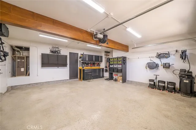 a view of a livingroom with furniture and a fan