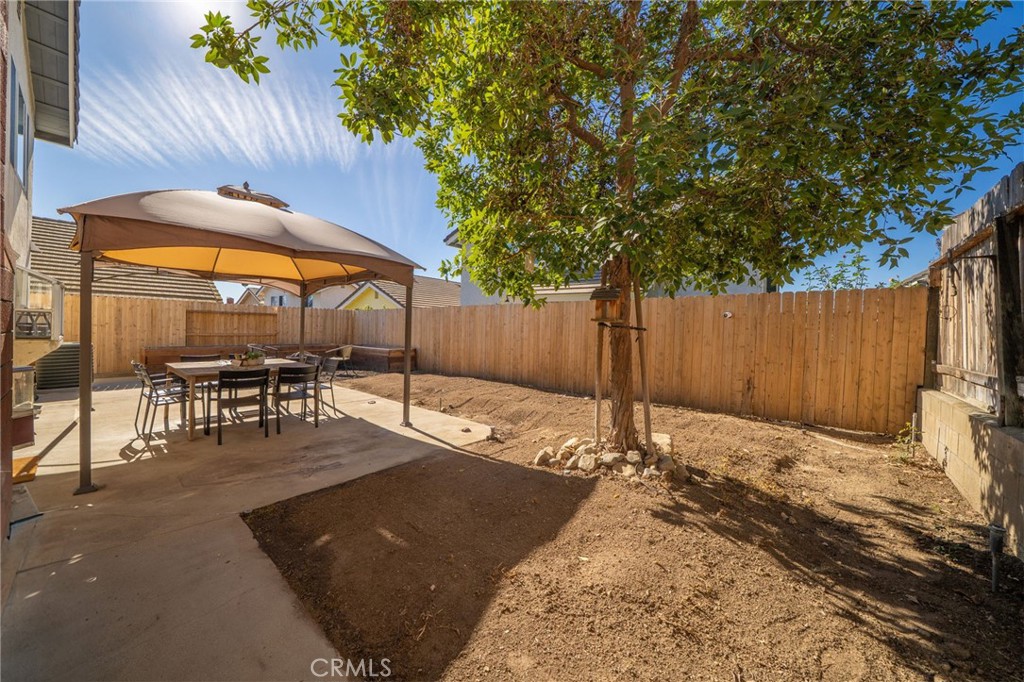 6870 Saddleback Place Rancho Cucamonga, CA 91701 - Photo 20 of 33 a backyard of a house with table and chairs