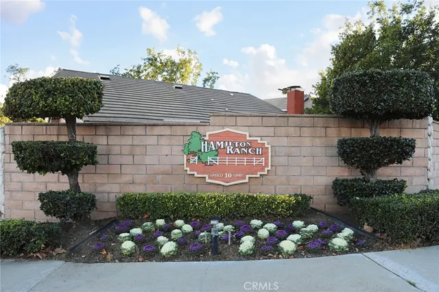 a front view of a house with yard and entertaining space