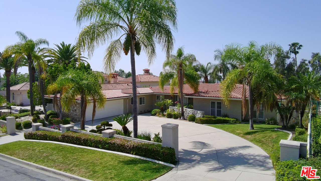 8697 Hillcrest Road Buena Park, CA 90621 - Photo 1 of 1 a front view of house with yard and green space