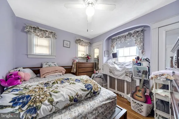 a bedroom with bed and a window