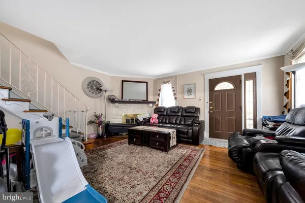 a living room with furniture fireplace and a table
