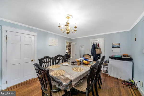 a view of a dining room that has a table and chairs in it