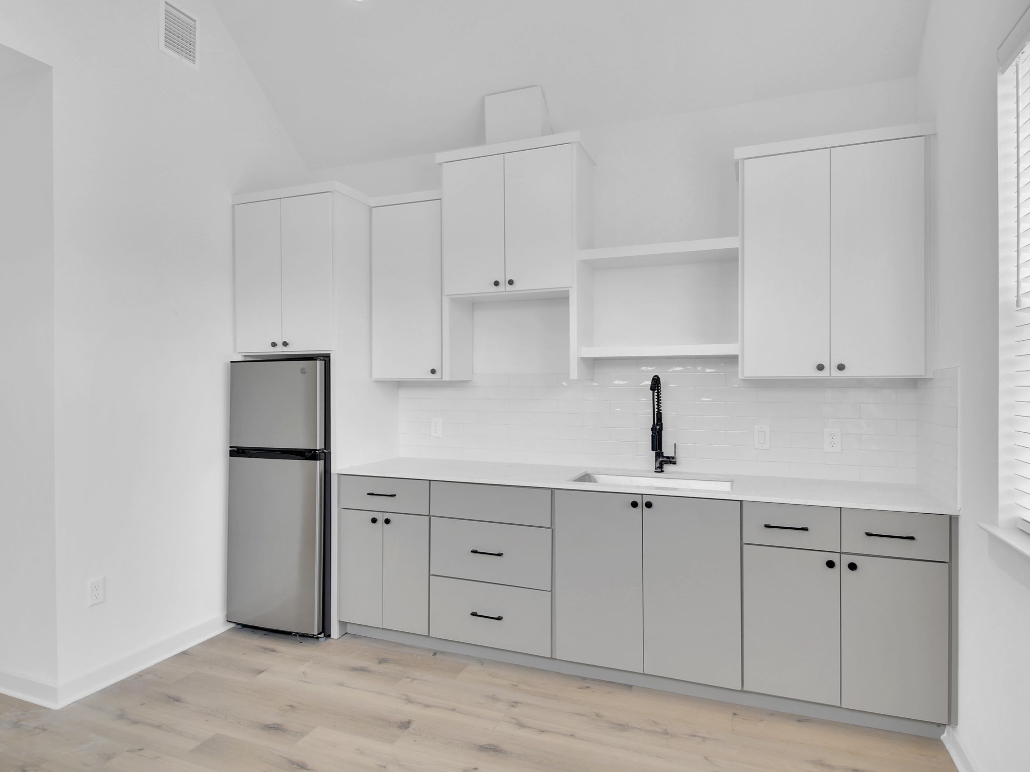 7208 Providence Avenue, Unit 3B Austin, TX 78752 - Photo 5 of 5 Full view of kitchen wall, has everything you need. Washer & dryer closet in unit, not pictured!