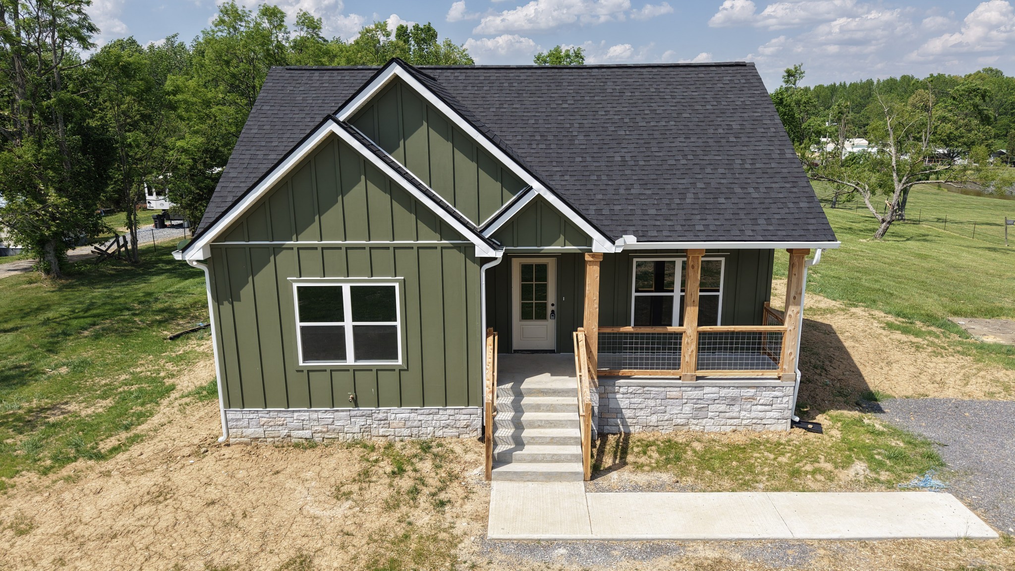 181 Rock House Hollow Road Bethpage, TN 37022 - Photo 50 of 51 a front view of a house with garden