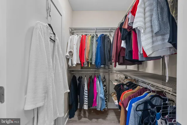 a bedroom with a bed and a walk in closet