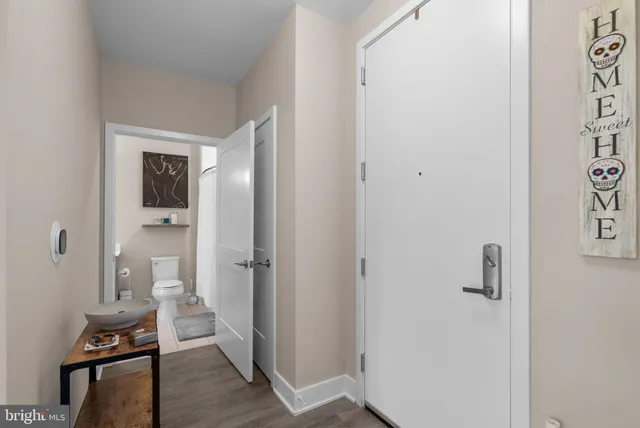 a white toilet sitting next to a bathroom sink