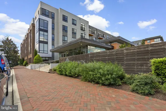 a front view of a building with garden