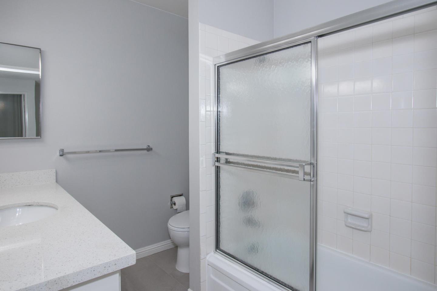 810 Juno Lane Foster City, CA 94404 - Photo 24 of 43 a bathroom with a glass shower door