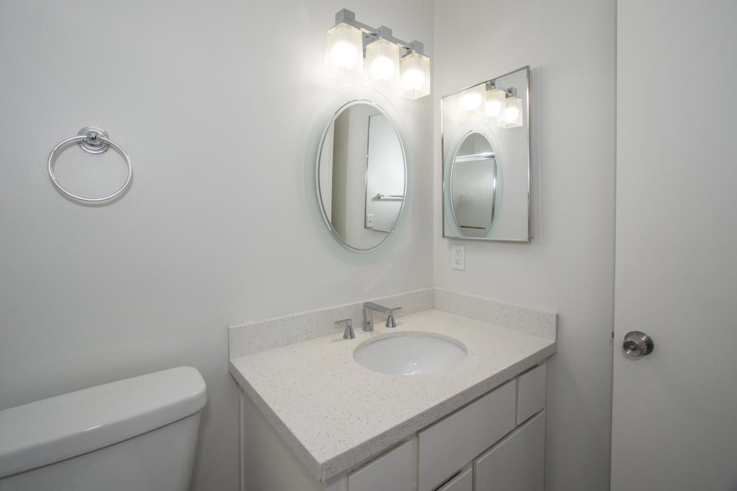 810 Juno Lane Foster City, CA 94404 - Photo 29 of 43 a bathroom with a toilet sink and mirror