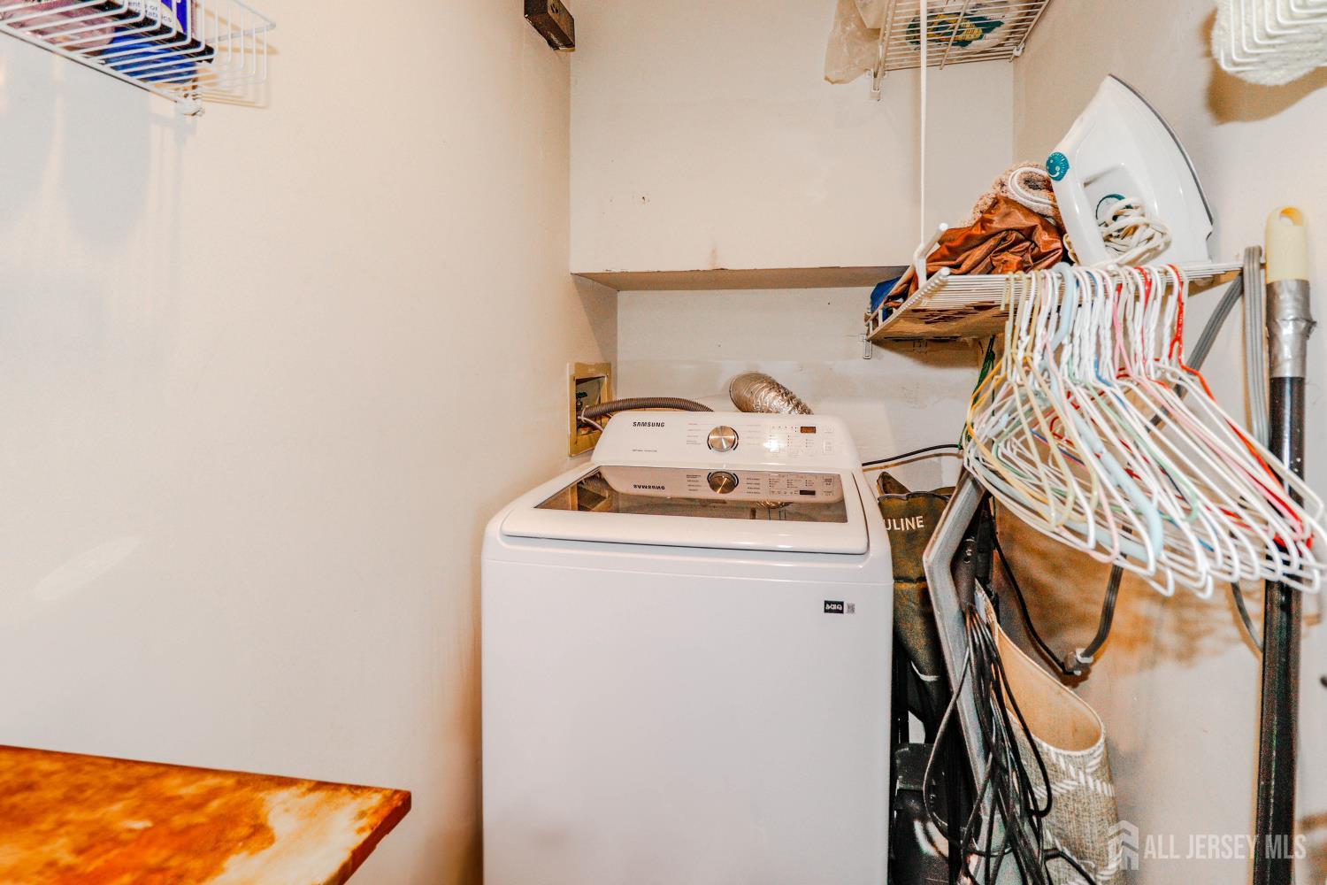 40 Fayette Street, Unit 57 Perth Amboy, NJ 08861 - Photo 11 of 33 a utility room with dryer and washer