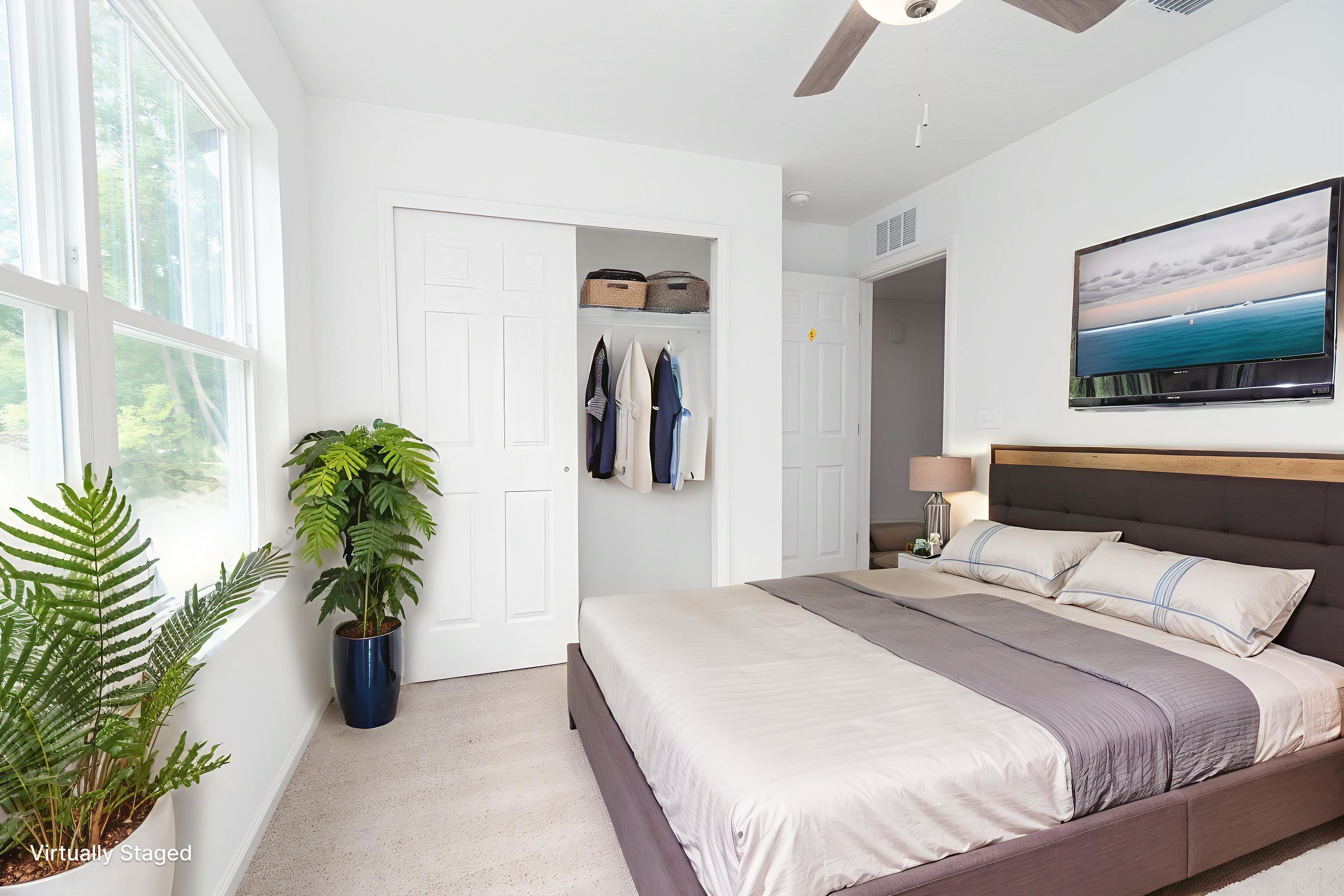 863 West 5th Street St. Augustine, FL 32084 - Photo 14 of 22 a bedroom with a bed and a potted plant