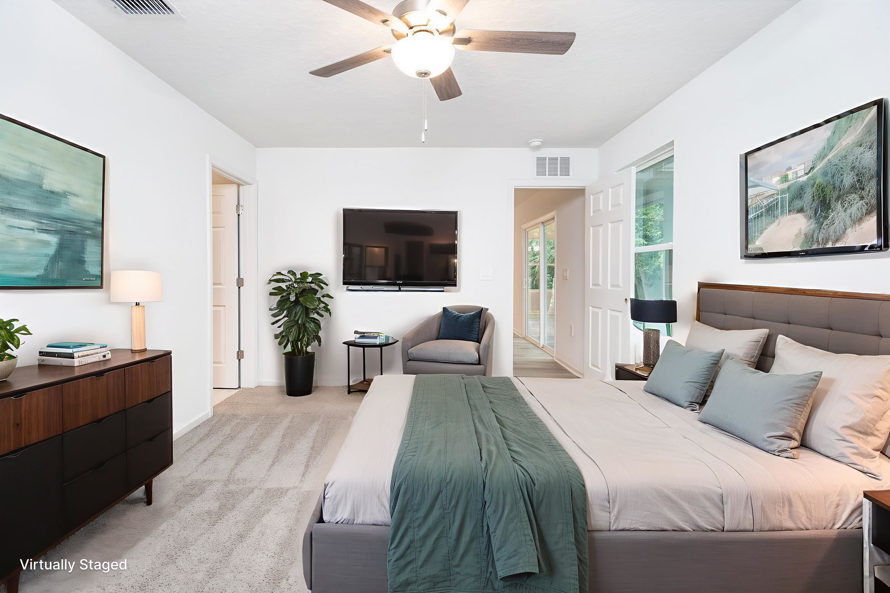 863 West 5th Street St. Augustine, FL 32084 - Photo 15 of 22 a bedroom with a large bed and a flat screen tv