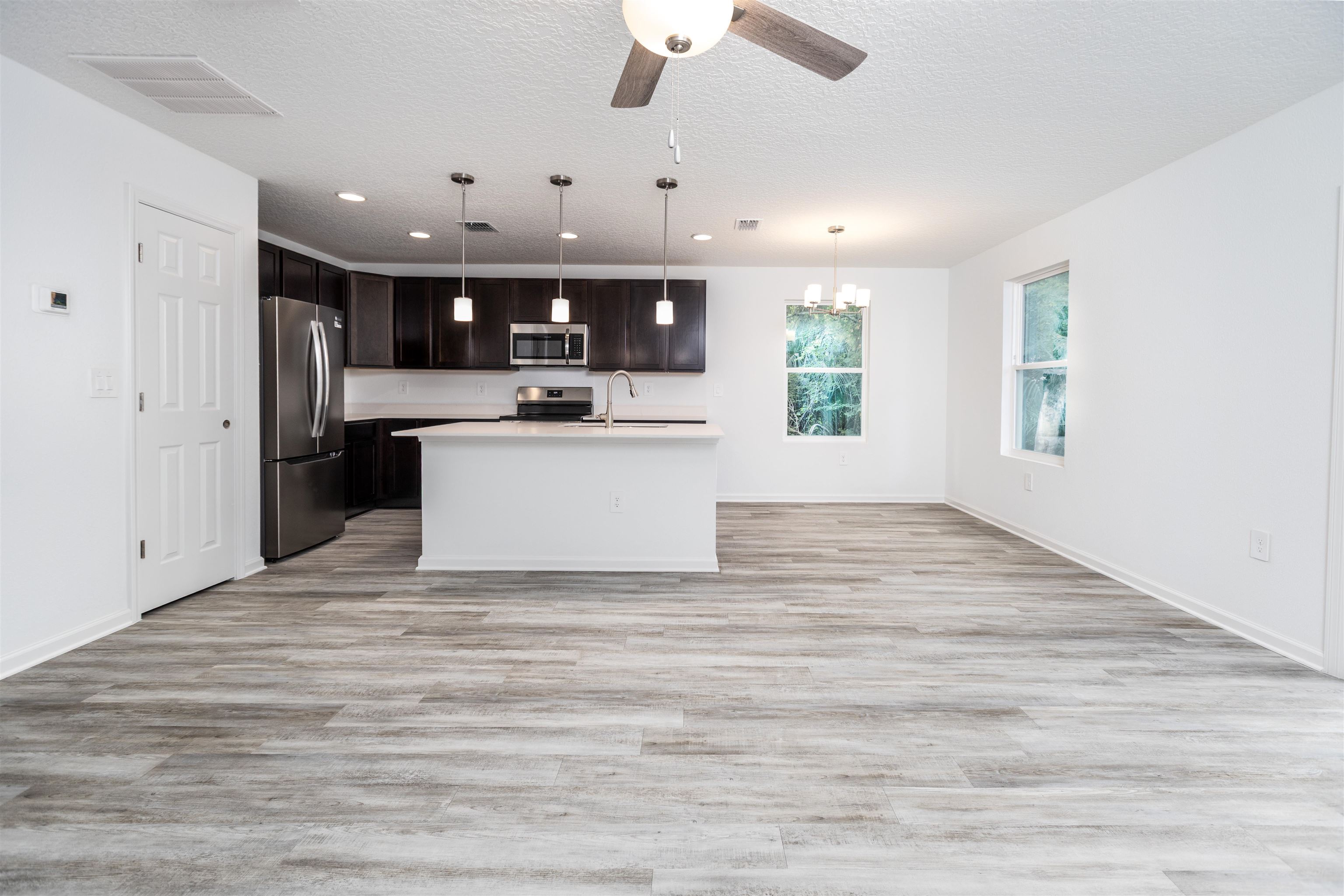 863 West 5th Street St. Augustine, FL 32084 - Photo 4 of 22 a view of kitchen with sink and microwave