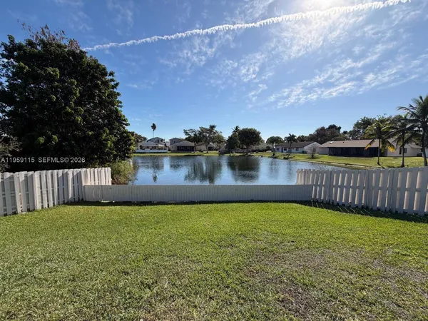 a view of a patio with a lake view