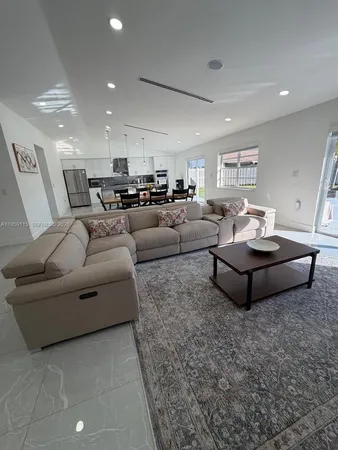 a living room with furniture and a couch