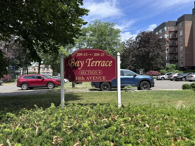 a view of a car parked in front of a house
