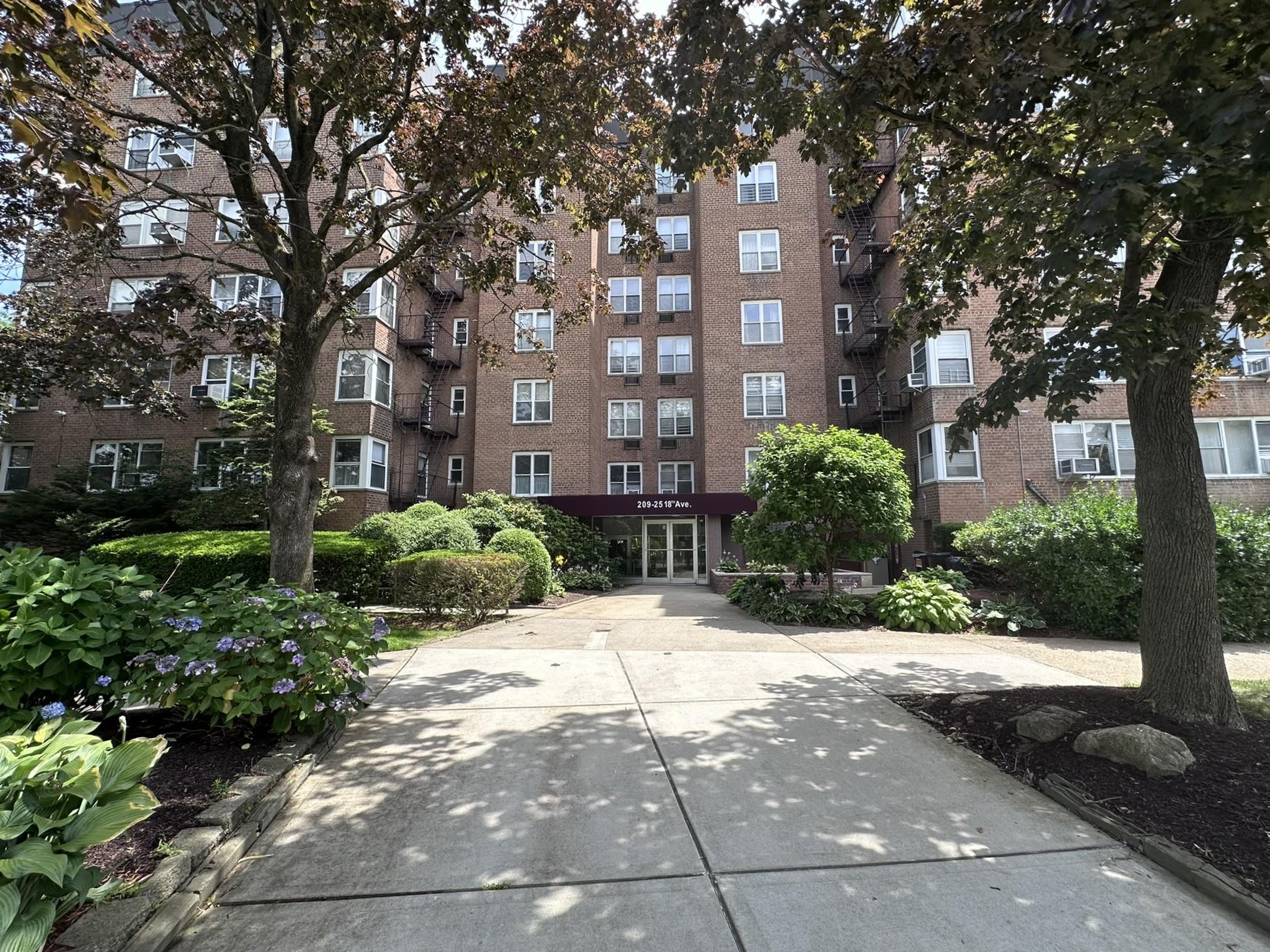 209-25 18th Avenue, Unit 1C Queens, NY 11360 - Photo 2 of 26 a view of a building with a pathway