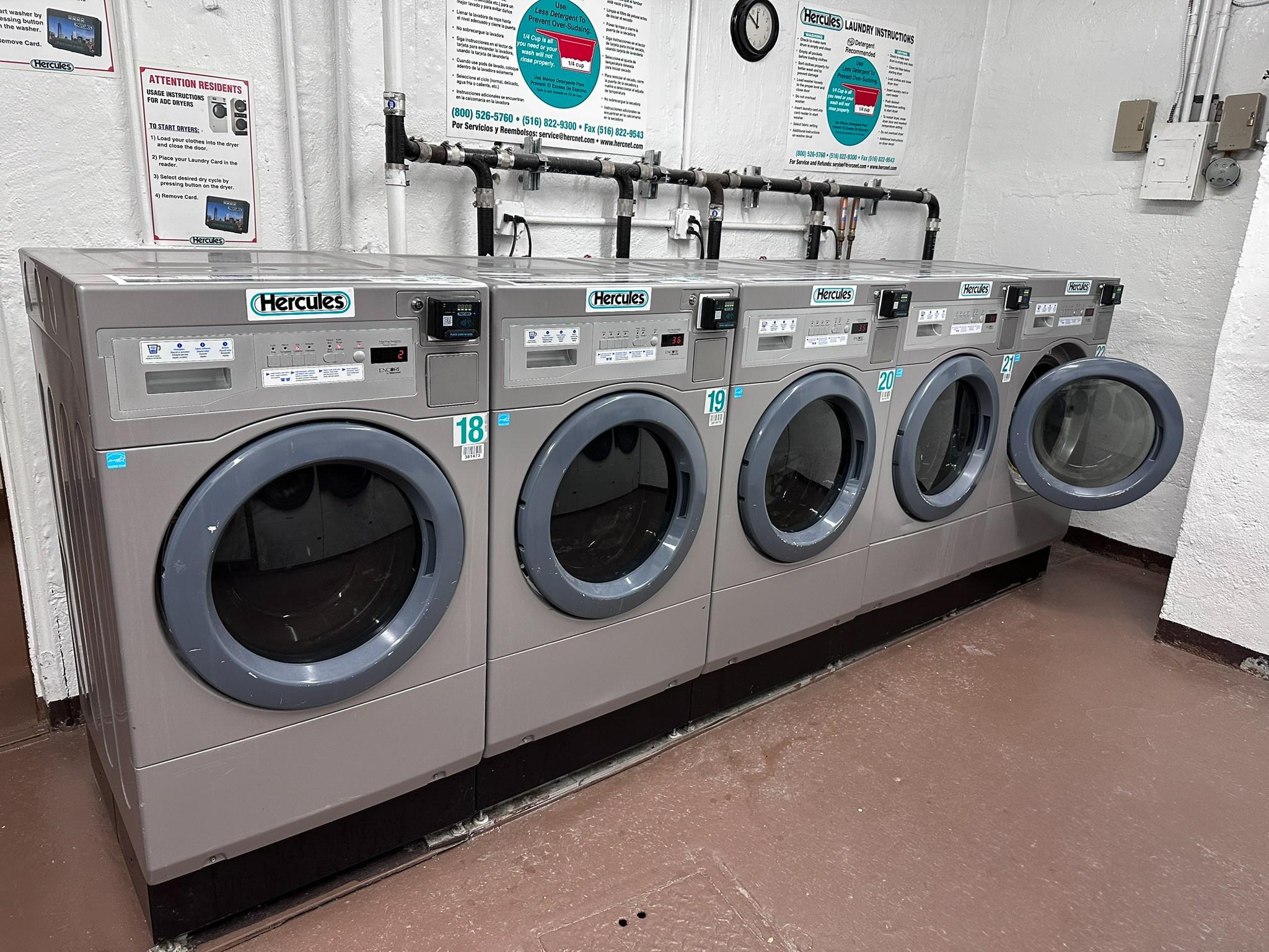 209-25 18th Avenue, Unit 1C Queens, NY 11360 - Photo 22 of 26 a utility room with dryer and washer