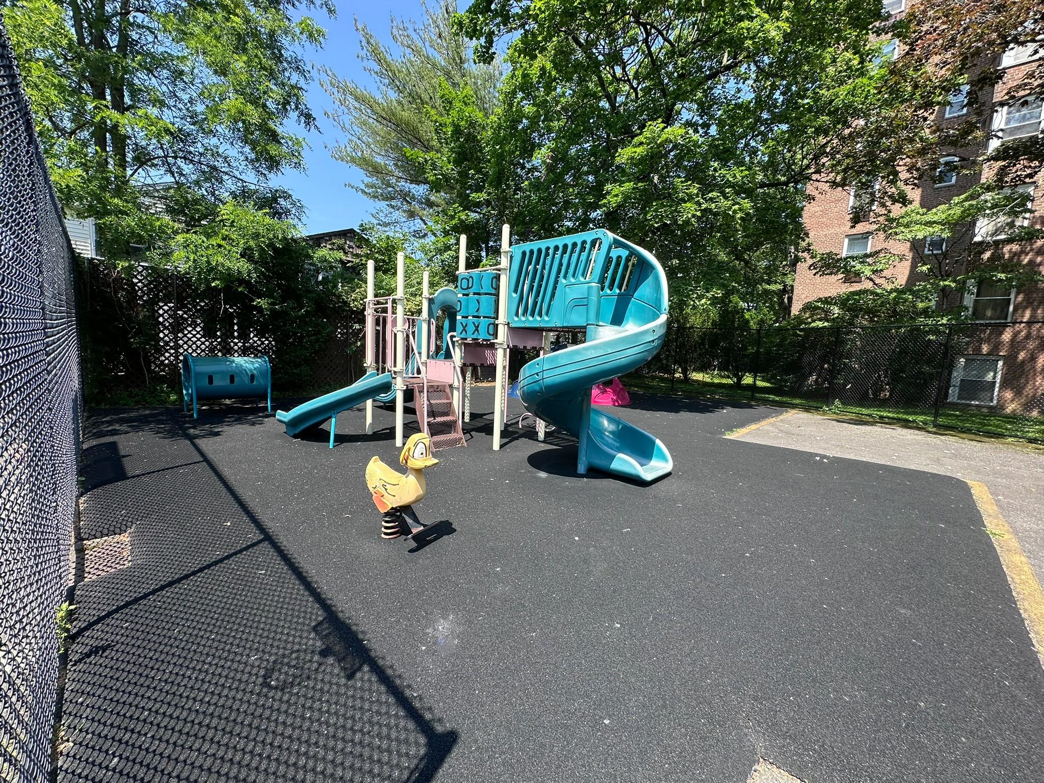 209-25 18th Avenue, Unit 1C Queens, NY 11360 - Photo 24 of 26 a view of a park with slide