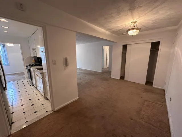 wooden floor in an empty room with a mirror
