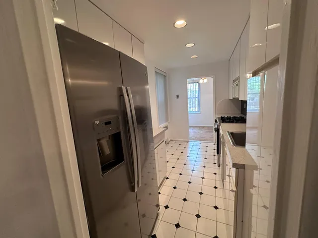a bathroom with a shower and a sink