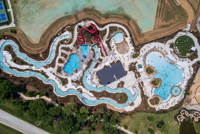 a view of a swimming pool with a yard