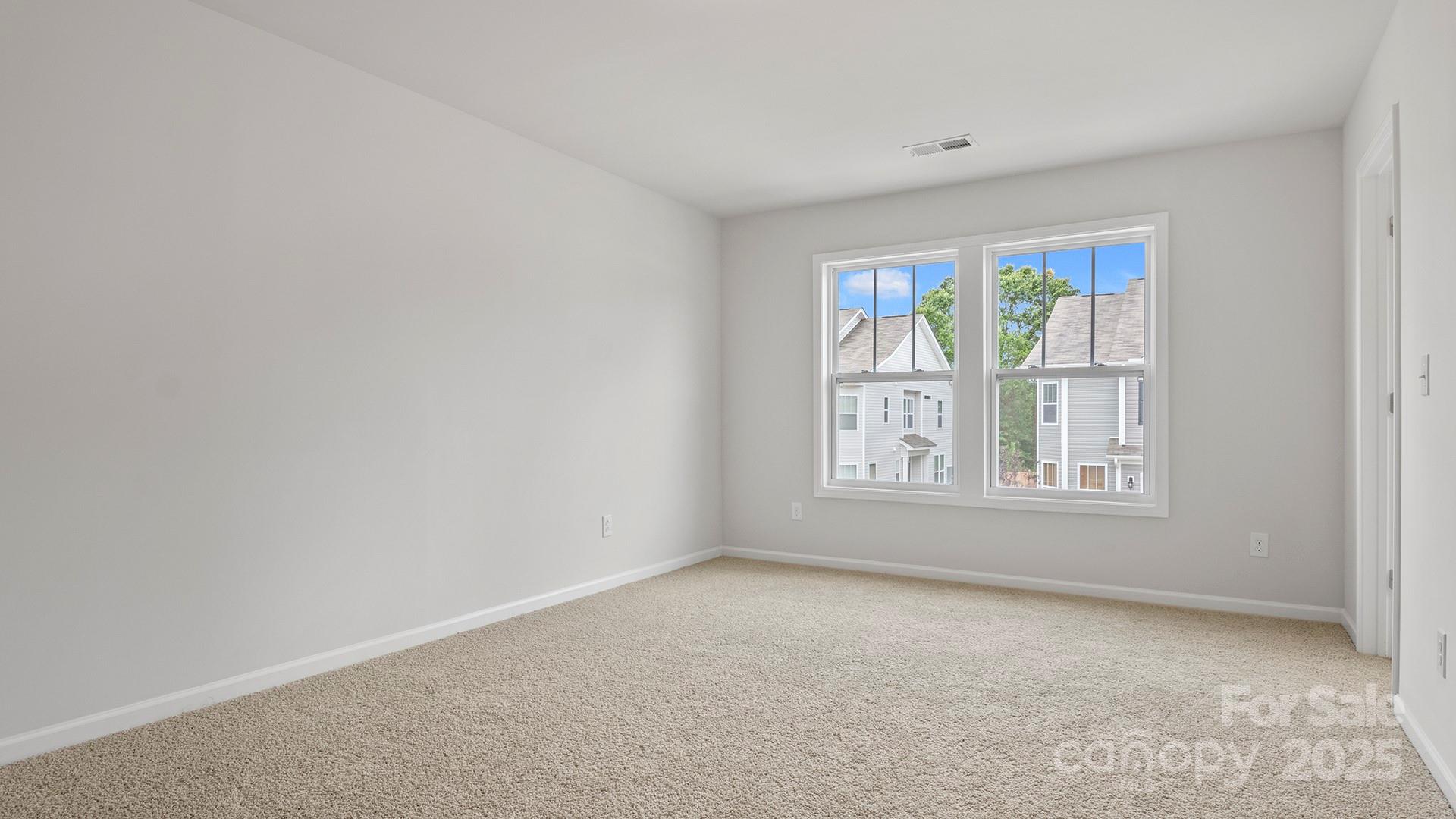 369 Creekview Road Hendersonville, NC 28792 - Photo 25 of 28 an empty room with windows