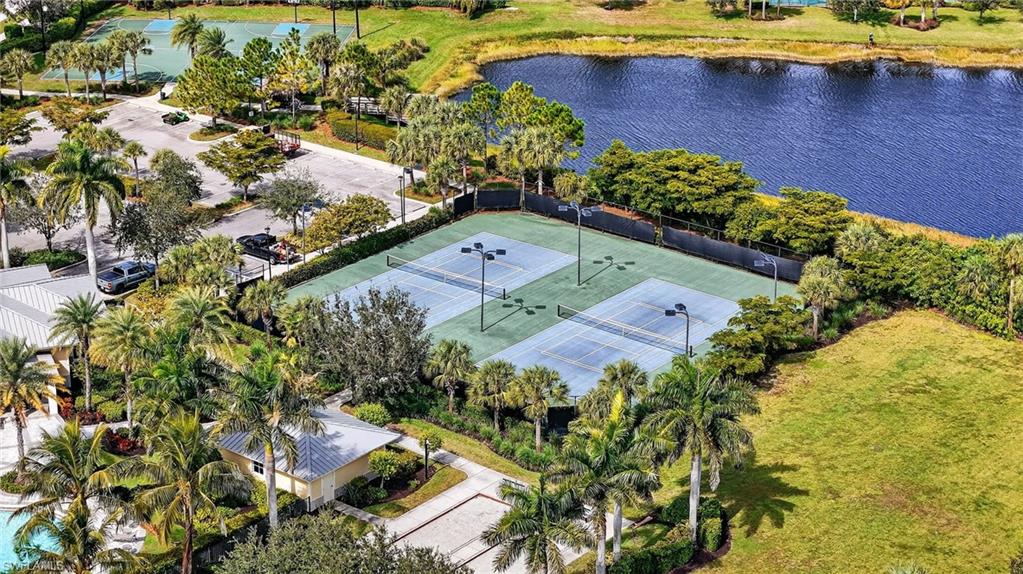2126 Hamlin Street Naples, FL 34120 - Photo 34 of 38 an aerial view of a house with a lake view
