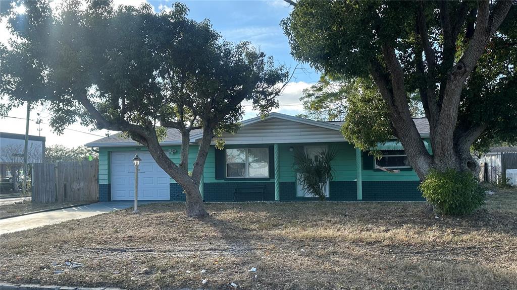 3505 Latimer Street New Port Richey, FL 34652 - Photo 2 of 20 a view of a house with a yard and a large tree
