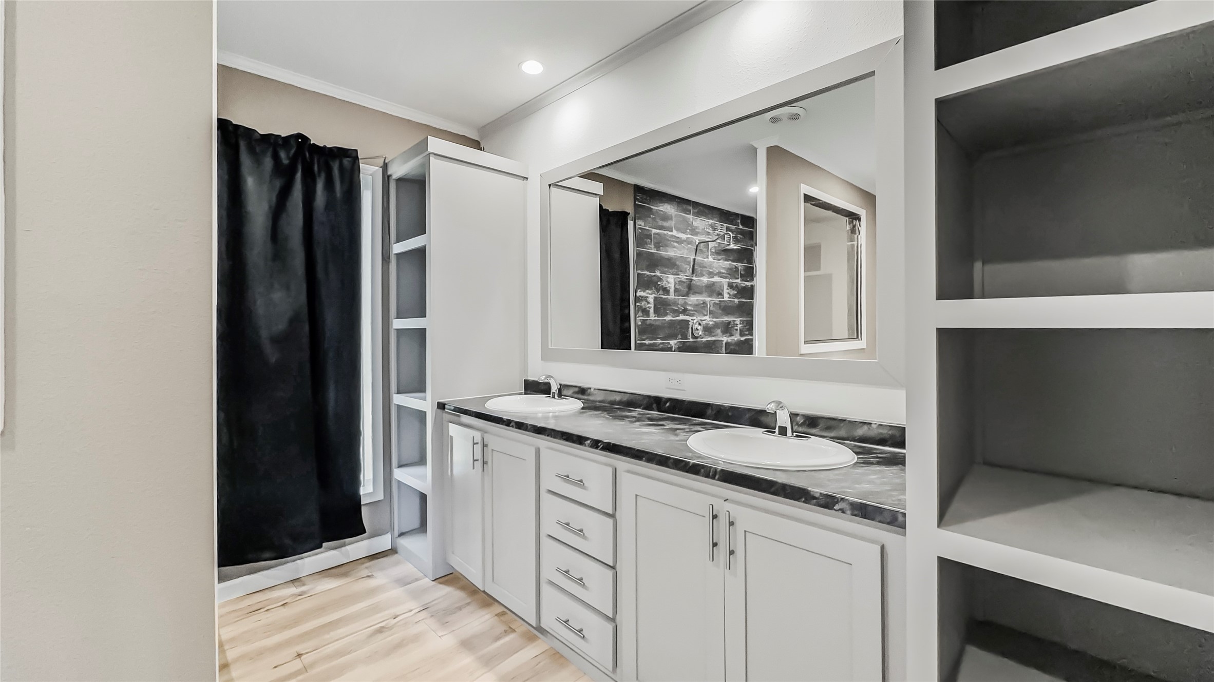 375 Lonesome Dove Trail Trinity, TX 75862 - Photo 23 of 40 a bathroom with a granite countertop sink and a mirror
