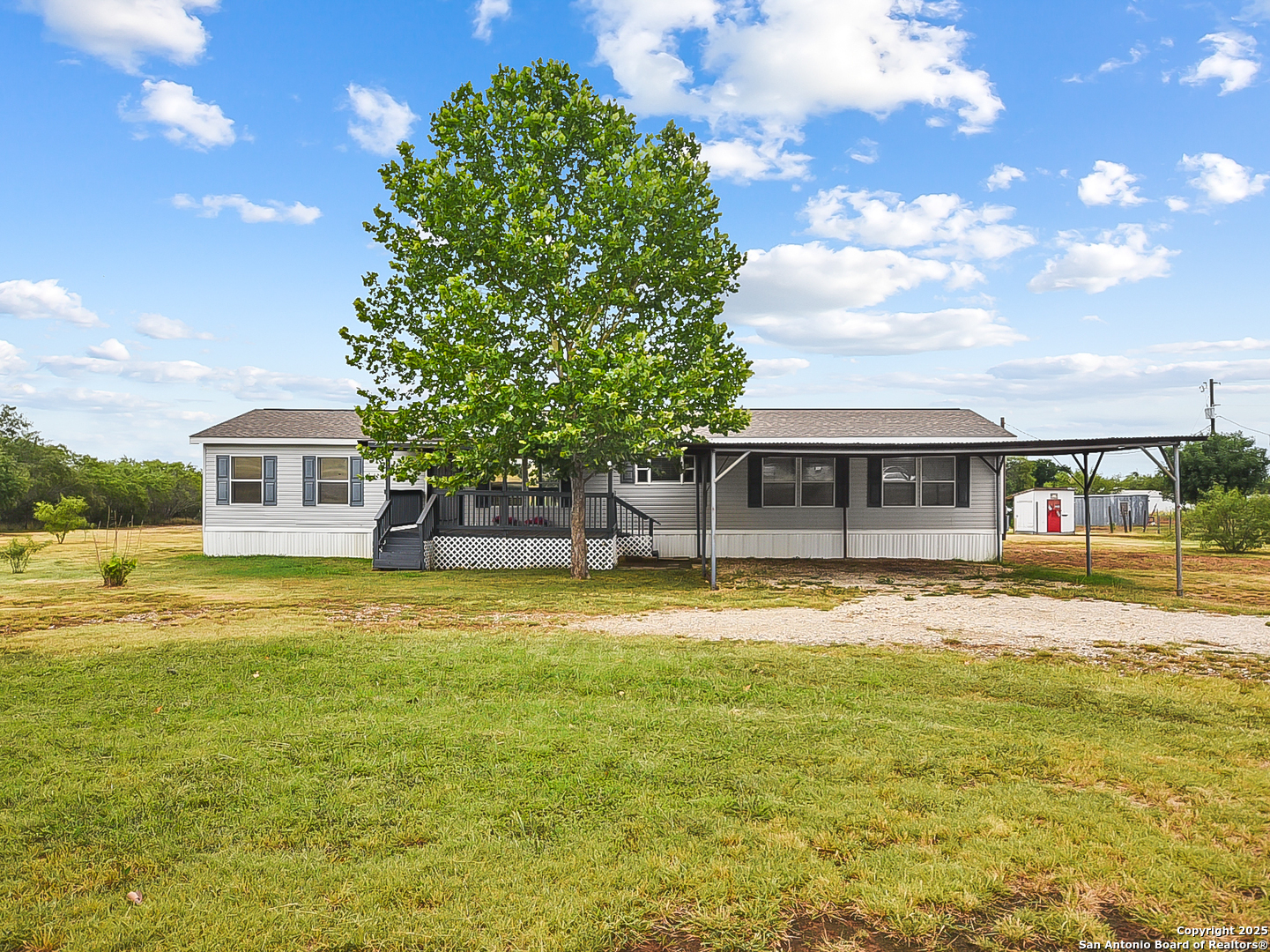 220 Northfield Drive Pleasanton, TX 78064 - Photo 1 of 1 a front view of a house with a yard