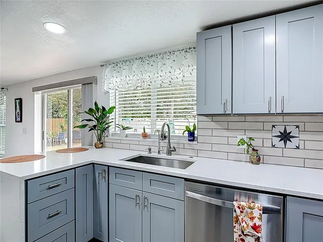 a kitchen with sink and window