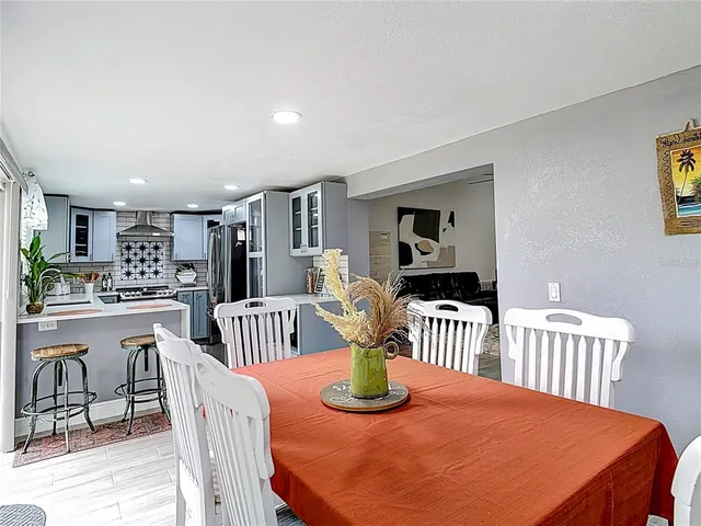a dining room with furniture a livingroom and chandelier