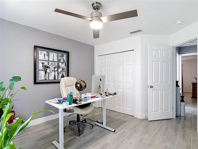 a workspace with furniture and wooden floor