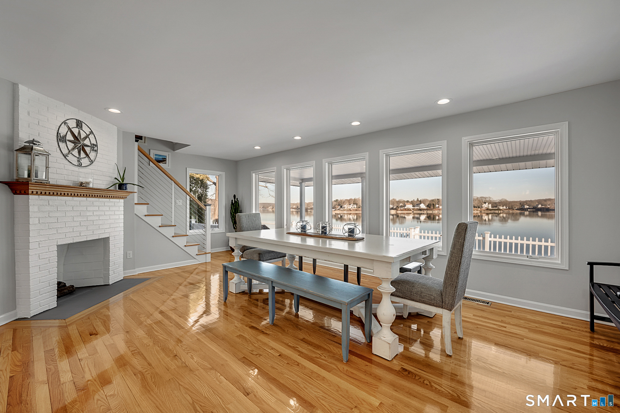 32 Bishops Bay Road East Lyme, CT 06357 - Photo 17 of 40 a living room with fireplace furniture and a wooden floor