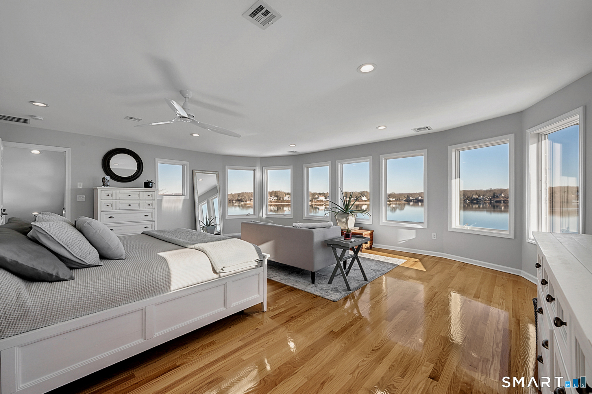 32 Bishops Bay Road East Lyme, CT 06357 - Photo 21 of 40 a bedroom with a bed and a chandelier