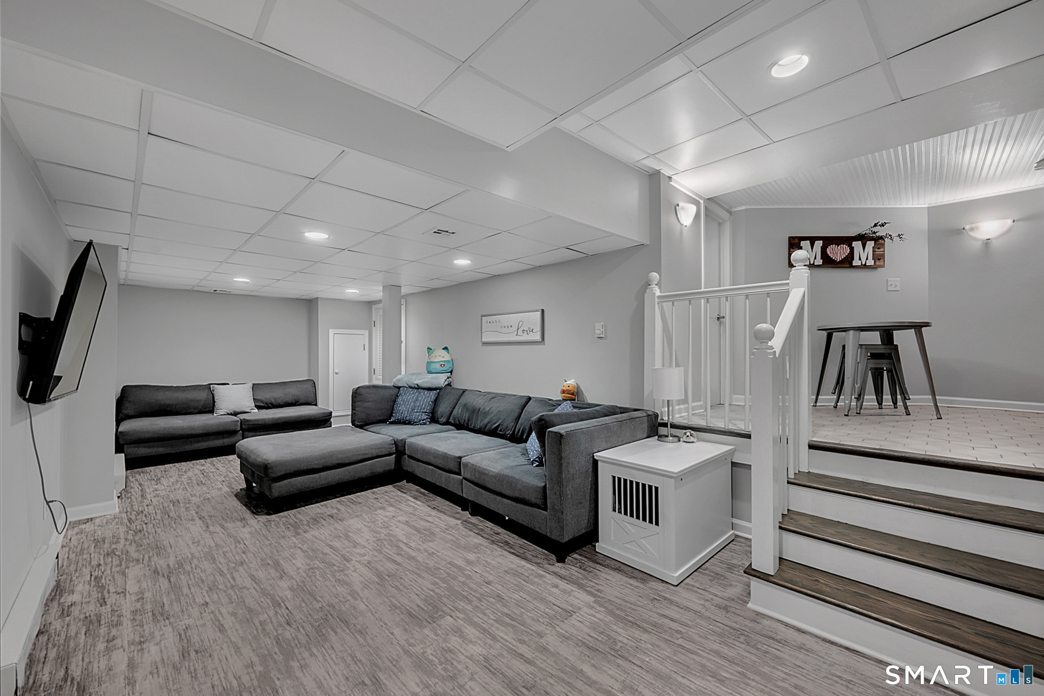 32 Bishops Bay Road East Lyme, CT 06357 - Photo 27 of 40 a living room with furniture and a flat screen tv