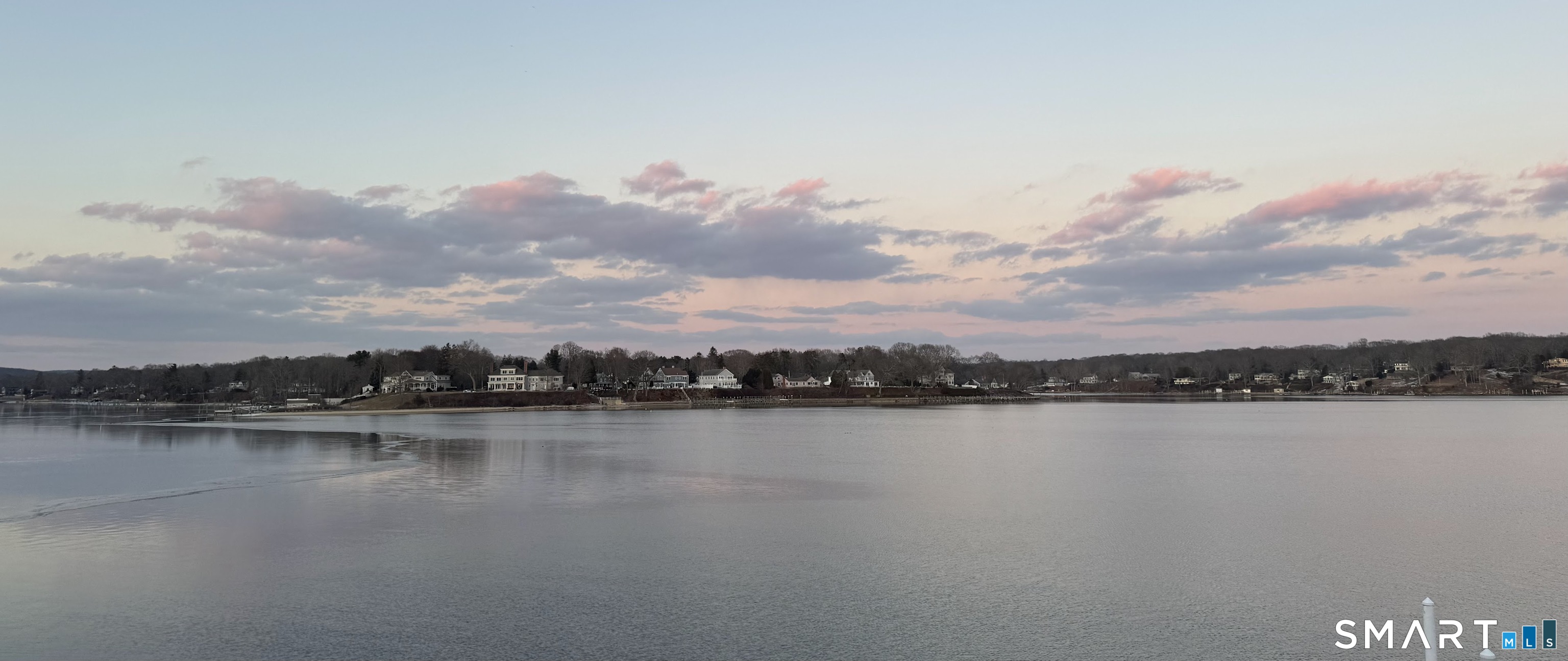 32 Bishops Bay Road East Lyme, CT 06357 - Photo 36 of 40 a view of a lake with houses in the back
