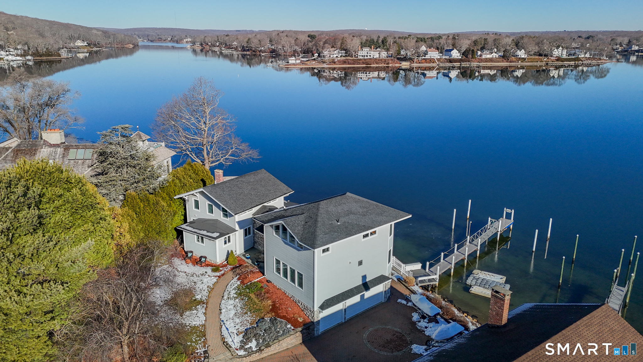 32 Bishops Bay Road East Lyme, CT 06357 - Photo 6 of 40 an aerial view of a house with outdoor space swimming pool and lake view