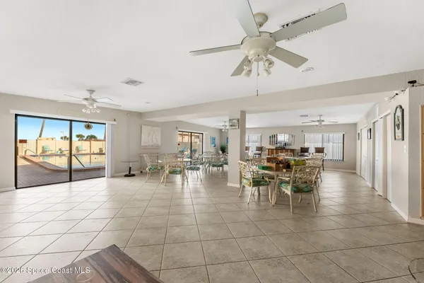a kitchen with granite countertop a stove top oven microwave and cabinets