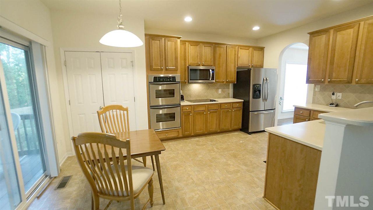 3030 Kilarney Ridge Loop Cary, NC 27511 - Photo 9 of 30 *Breakfast Nook*Large Pantry*Sliding Doors to the Screened Porch*Oven is currently not working but will be repaired/replaced*