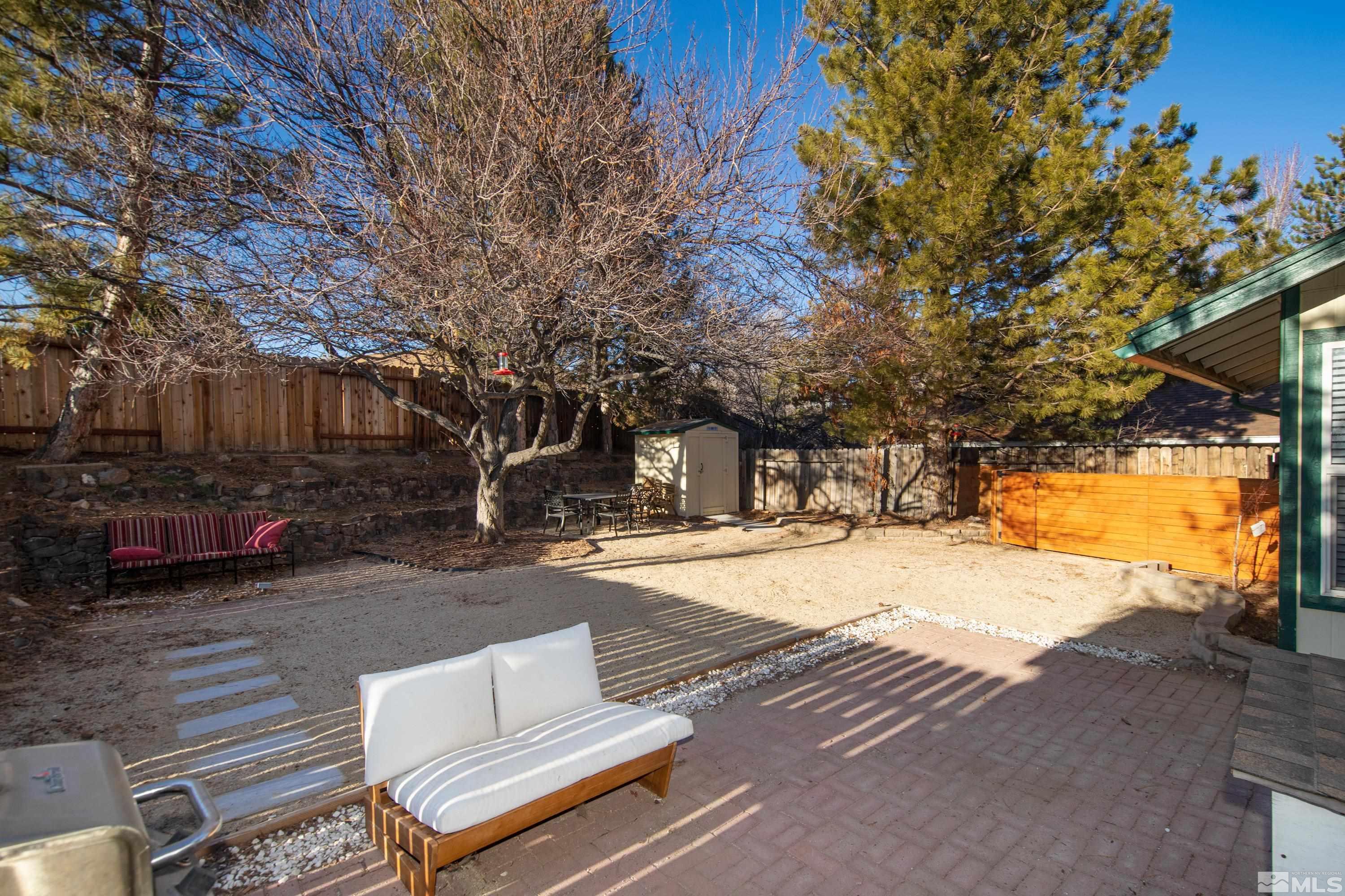 1195 Westlake Road Reno, NV 89523 - Photo 26 of 28 a wooden bench sitting in front of a building