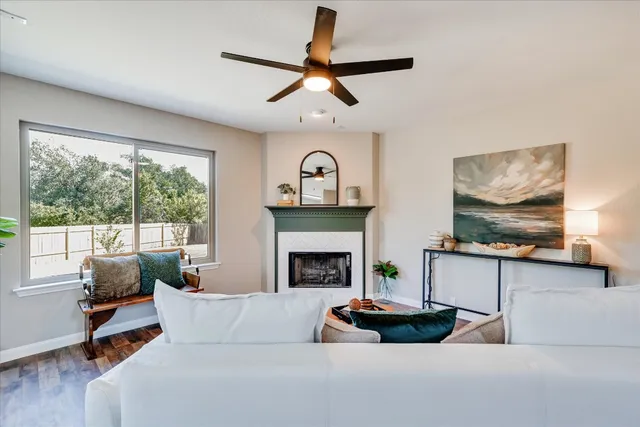a living room with furniture and a fireplace