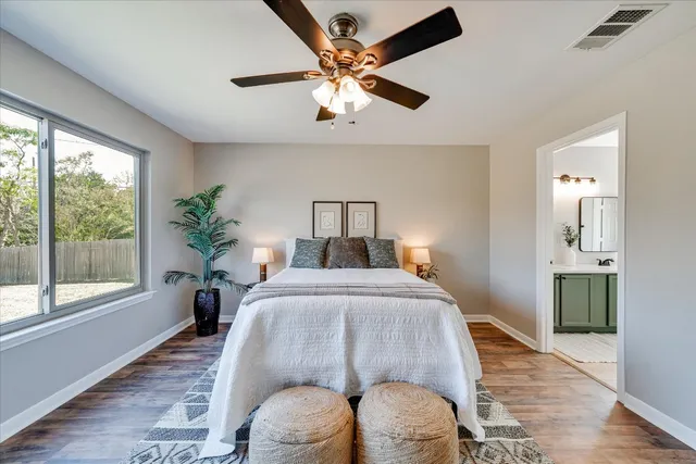 a bed room with a bed and a window