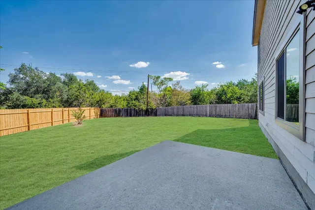 a view of a yard and basketball court