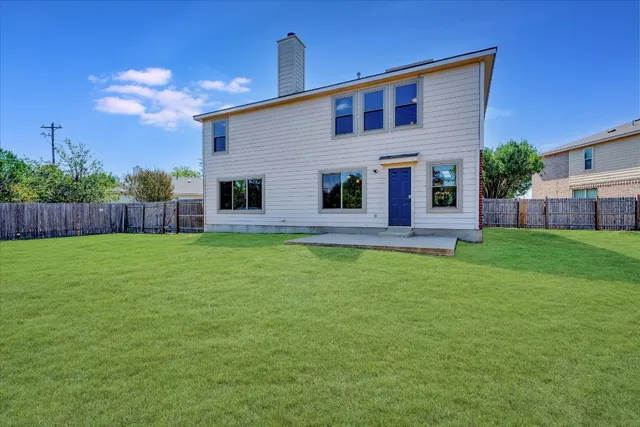 a front view of house with yard and outdoor seating
