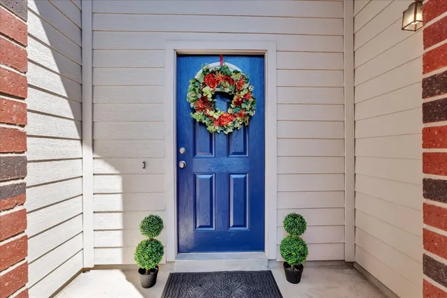 a vase with flowers sitting next to a window