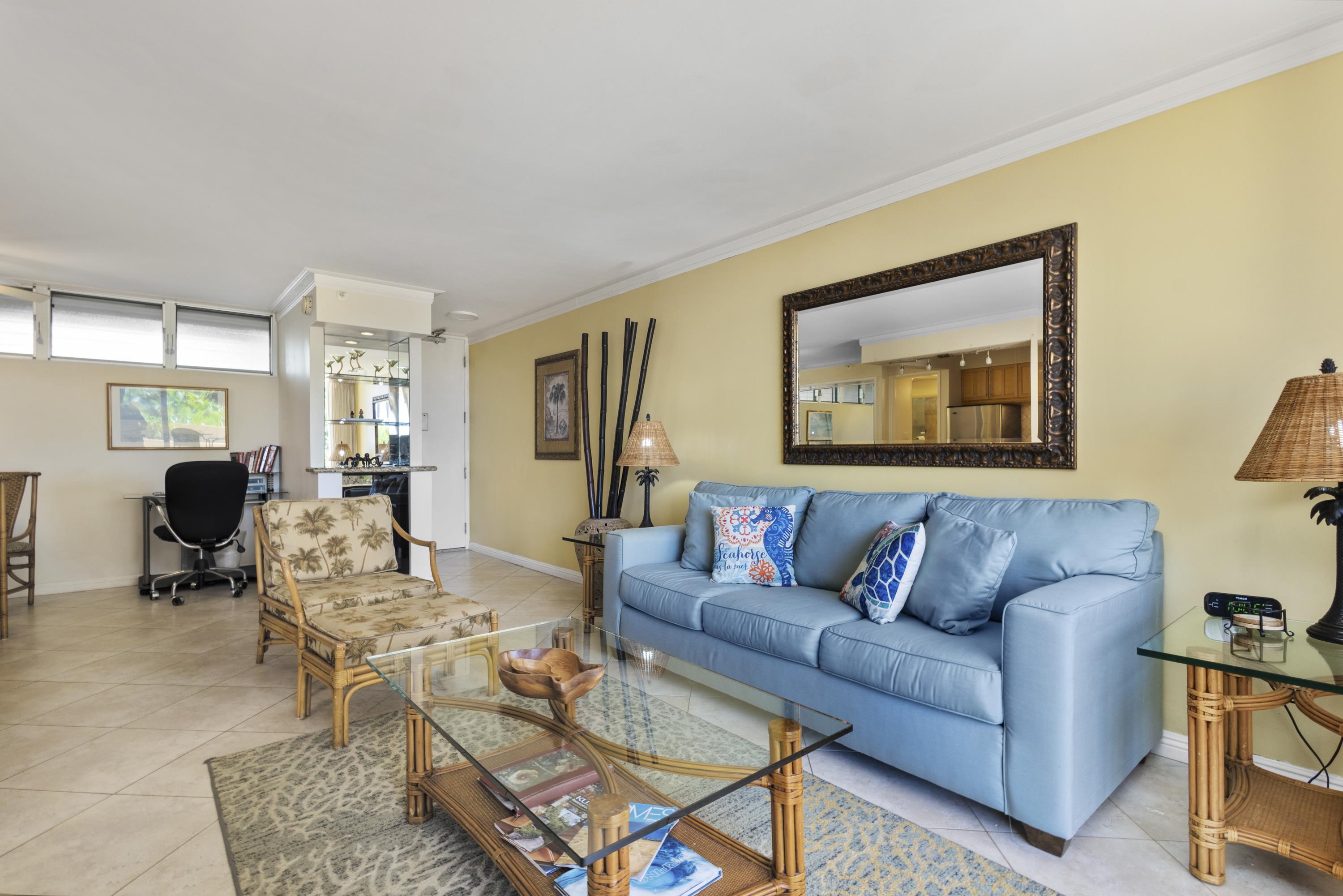 4365 Lower Honoapiilani Road, Unit 115 Lahaina, HI 96761 - Photo 14 of 44 a living room with furniture and a window